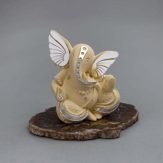 Ivory Ganesha on Petrified Stone