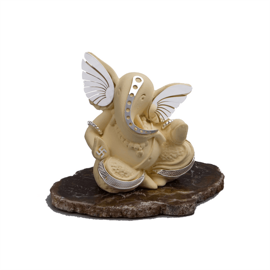 Ivory Ganesha on Petrified Stone