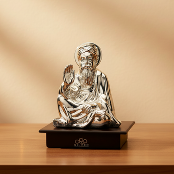 Silver Guru Nanak Dev on wood base